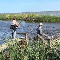 Carmen and Laurel with a fish.