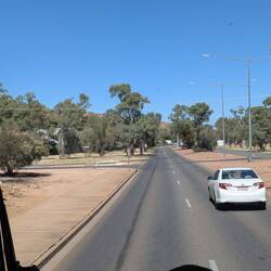 The road into Alice Springs. Quite different vegetation.
