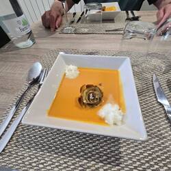 Pumpkin soup with cheese foam and a fried artichoke heart. Yummy. Tasted like chicken soup.