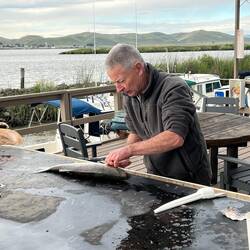 Gary cleaning fish