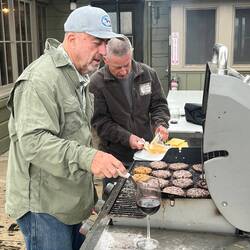 John and Gary cooking the burgers.