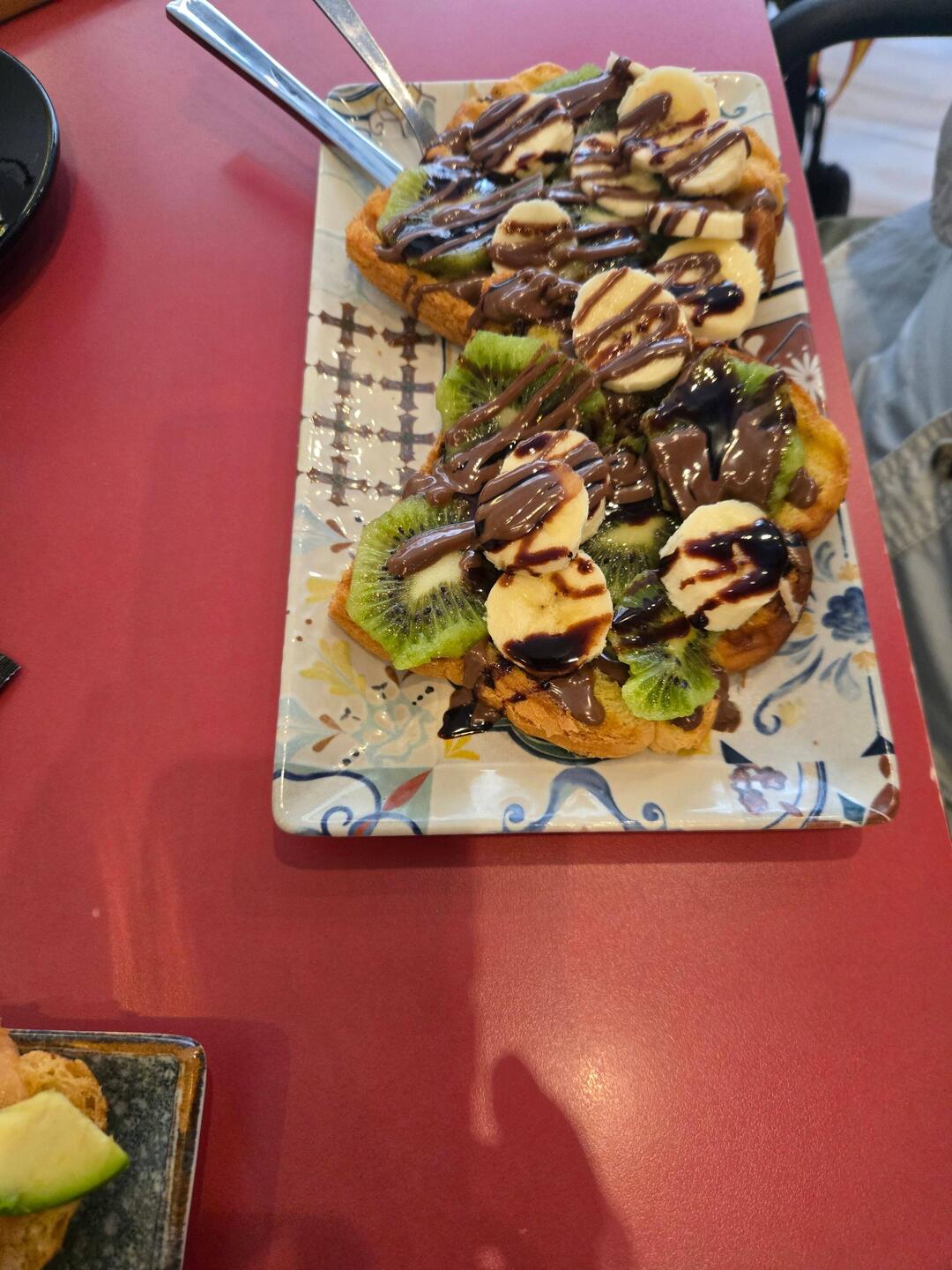 Phil had banana, kiwi, Nutella chocolate toast and coffee.