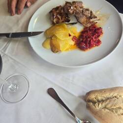 Phil had a pork steak, potatoes and peppers.