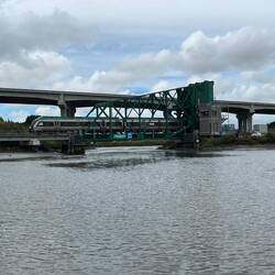 Train going over the now closed bridge.