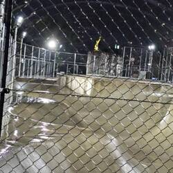Cool rooftop park with a skate park, climbing wall, volleyball, trees, etc.