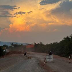 Dramatic golden tropical clouds as we rolled around more roadworks to find a guesthouse.