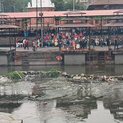 Large family participating in the ritual cremation of a husband/father