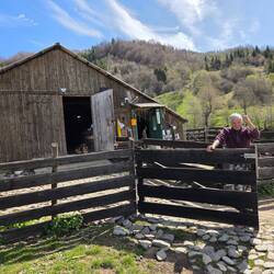 Farmer PaPa who lives on the farm behind green door where he has bed, kitchen and bathroom.