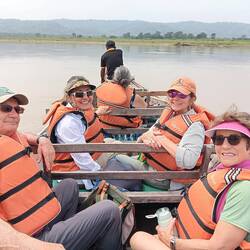 Crossing the river in a village-made canoe