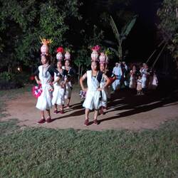 Thanu young adults performing a dance.