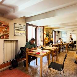 Mui perusing the menu at La Risorta Osteria del Re Fosco — Padova, Italy.