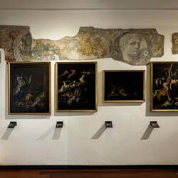 Art against frescos from when the museum was a monastery.