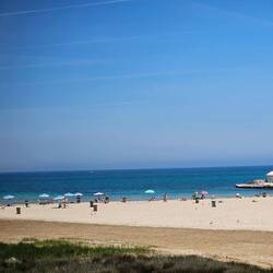 Some people were swimming, but most were sun baking