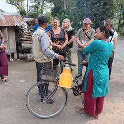 Visiting with a woman from the local village who milks her cows and sells the milk using her bicycle