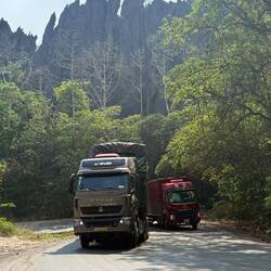 Trucks think nothing of overtaking their slower counterparts on tight bends, looming towards us.