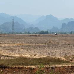 We’re cycling in a beautiful oven. The hot air dries out our eyes. Hazy rock and dusty fields.