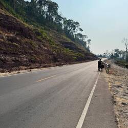 The heat building, the 5mile climb to 1500ft summit was slow. The road was wide and newly built...