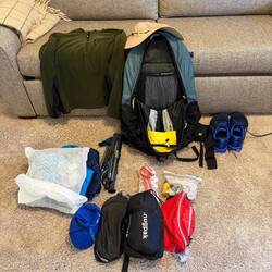 Under 9 pounds without good and water but with the hiking poles!