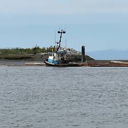 Another tug at a log boom