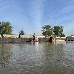 Loading railway cars onto a barge.