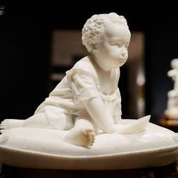 "Baby with saucer on a cushion" ... pedestal attributes to Magni; internet attributes to Fiaschi.