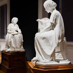 I love the way these two sculptures were placed like the woman on the left is drawing the other one.