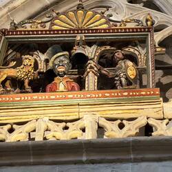 The "negrillo" opens his mouth when the guy on the right strikes the hour. In the cathedral???