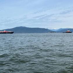 Tug pulling barge