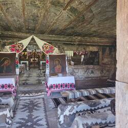 Women sit in the back of the church, men sit in front where the altar is, even till today.