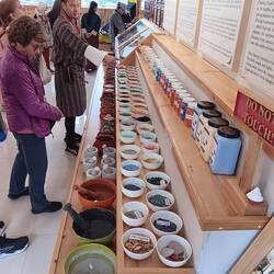 Display of traditional dyes used to color yarns for weaving
