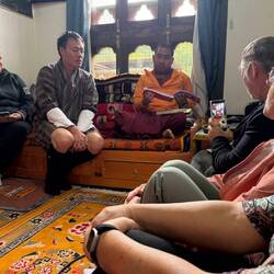 Getting astrological information from a Buddhist monk, with archery on his TV
