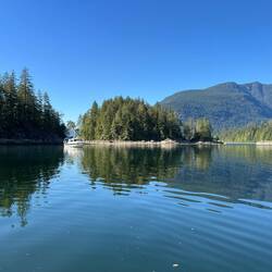 On my kayak, looking back at C-Traveler and the private island