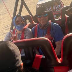 Carina and James on the 10 passenger dune buggy.