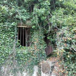 The start of our hill climbing adventure, a cave just past the foreboding gates