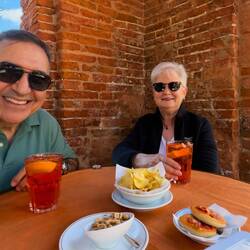 Aperol Spritz time at the public granary — Comacchio, Italy.