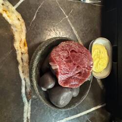 happy beef. Wagyu beef grilled on massage stones and seared with a blow torch.