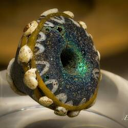 Blue glass spindle whorl.