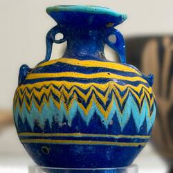 Multi-colored glass amphoriskos.