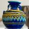 Multi-colored glass amphoriskos.