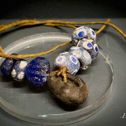 Glass beads and cypraea necklace.