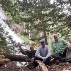 Mike, Bill and Me. Sitting at the Trapper's Cabin, with the waterfall behind us.