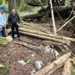 Mike and Bill checking out the cabin remains.