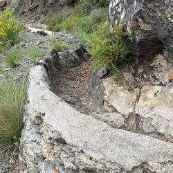 Stone- lined acequia