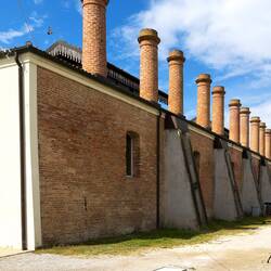 The chimneys of the cooking hall at the Manifattura dei Marinati in Comacchio.