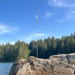 One of several poles local residents have marked rocks with. We are at low tide.
