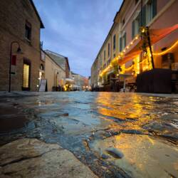 Cobblestones and rain — Ravenna, Italy.