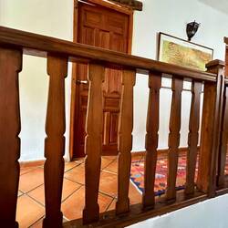 The same style of flat wooden balustrades in our house