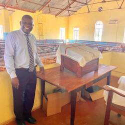 Rev Chiwa at the original pulpit