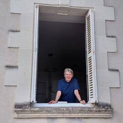 Elaine checking out the passing parade from our living room window