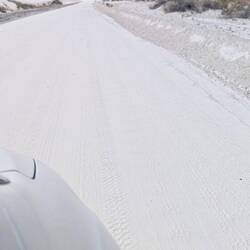 The sand road looks like snow. It gets plowed daily because of the blowing sands.